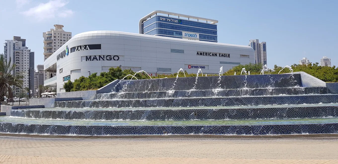 Ir Yamim Mall with fountains and nearby apartment towers in Netanya